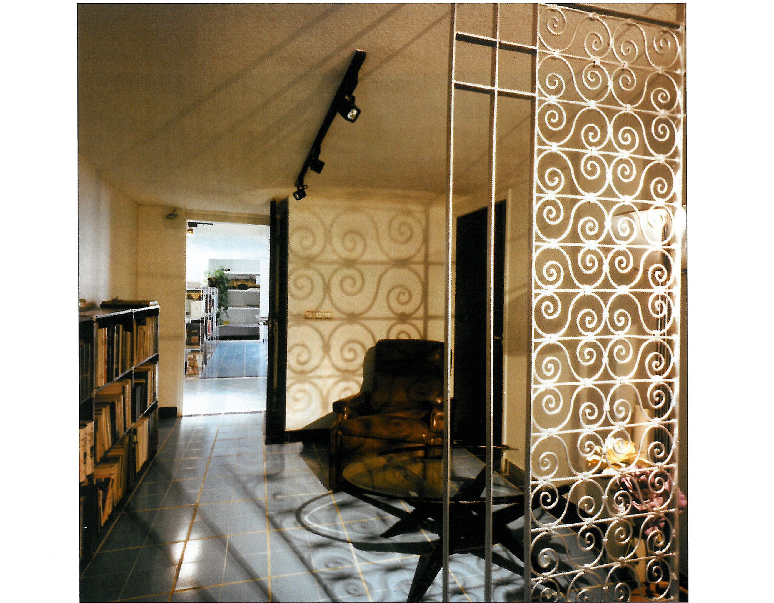 The archive and library bay: combination of custom-built shelving with off-the-shelf market materials