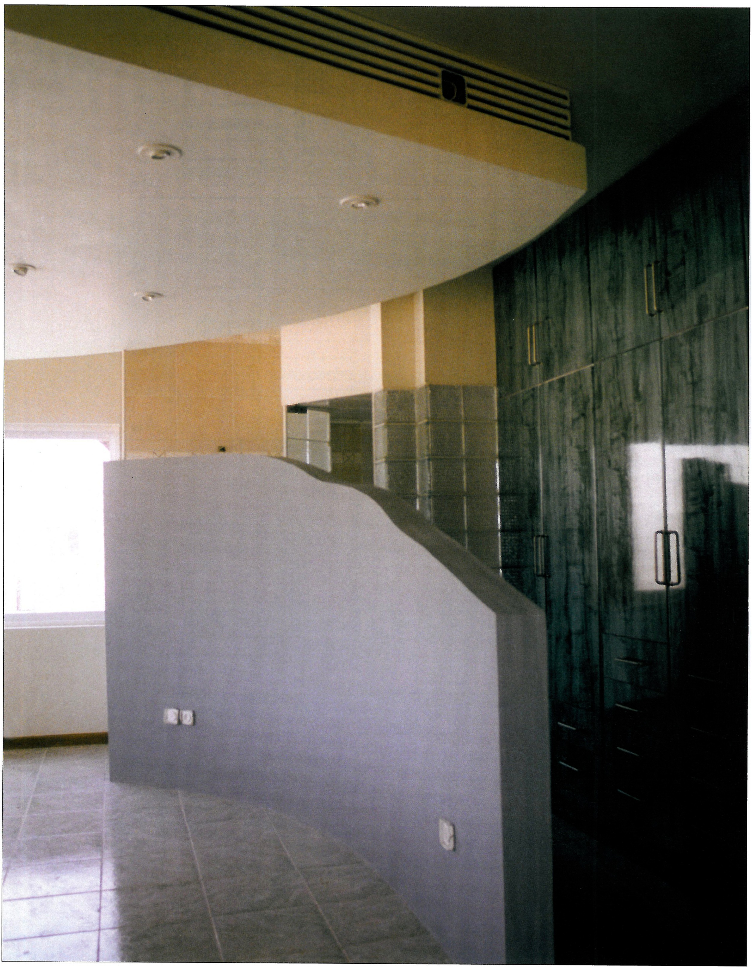 Interior view of the timber-and-metal partition together with the iron fireplace