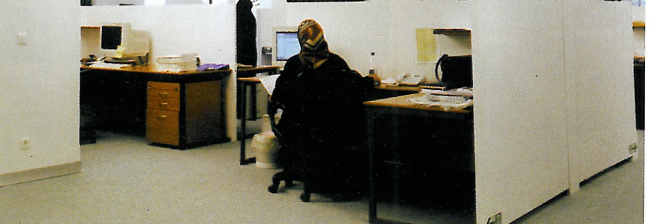 Manager's office: volume of work with white partitions, indirect ceiling lighting, and turquoise floor