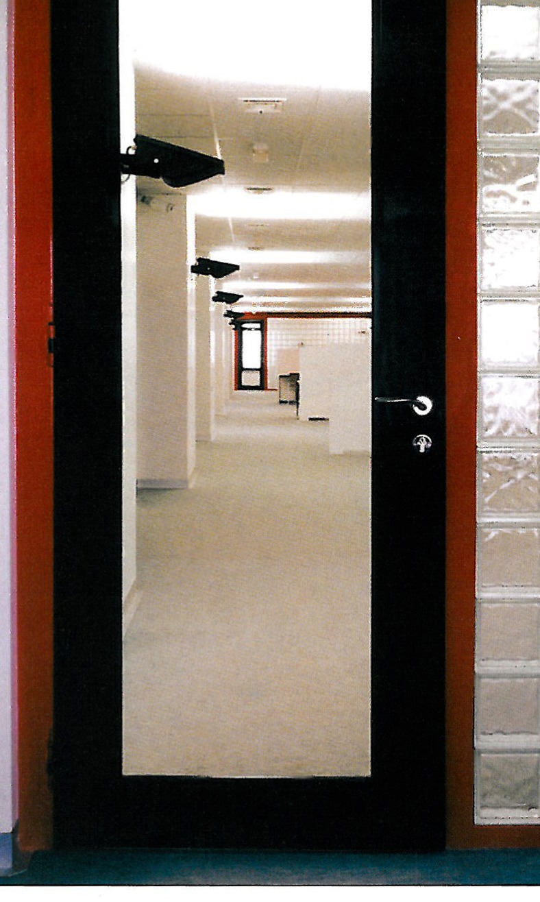 Senior manager's office interior: glass, white volumes, and indirect ceiling lighting