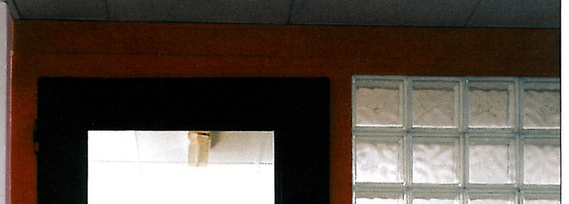 Partition execution detail: electrical and computer trunking running from floor up through the partition to the desk