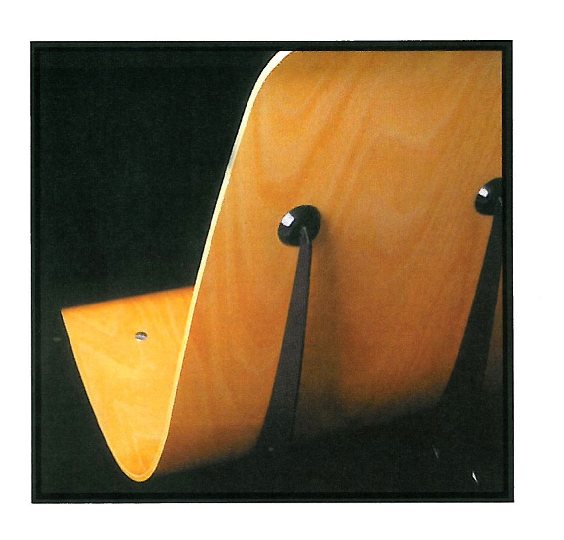 Prouvé's table: curved metal legs and a bright timber surface, a precise pattern of form and function