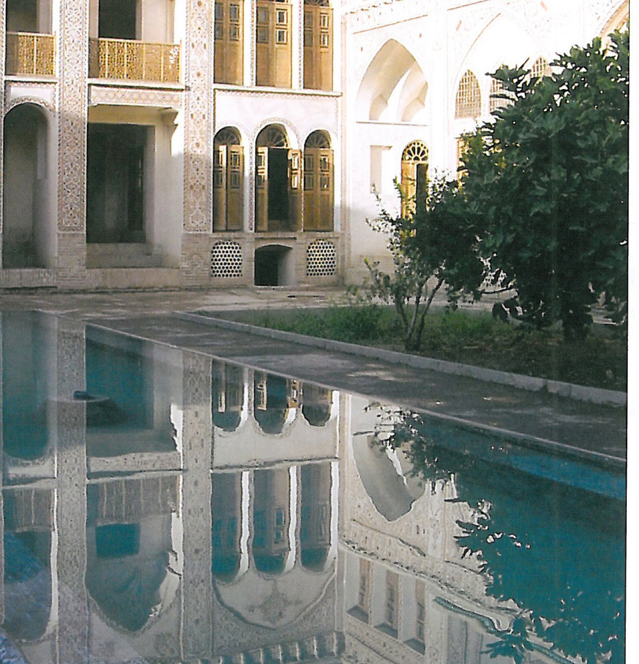 South-facing view of the villa with open terraces and the exaggerated colonnade overlooking the plain