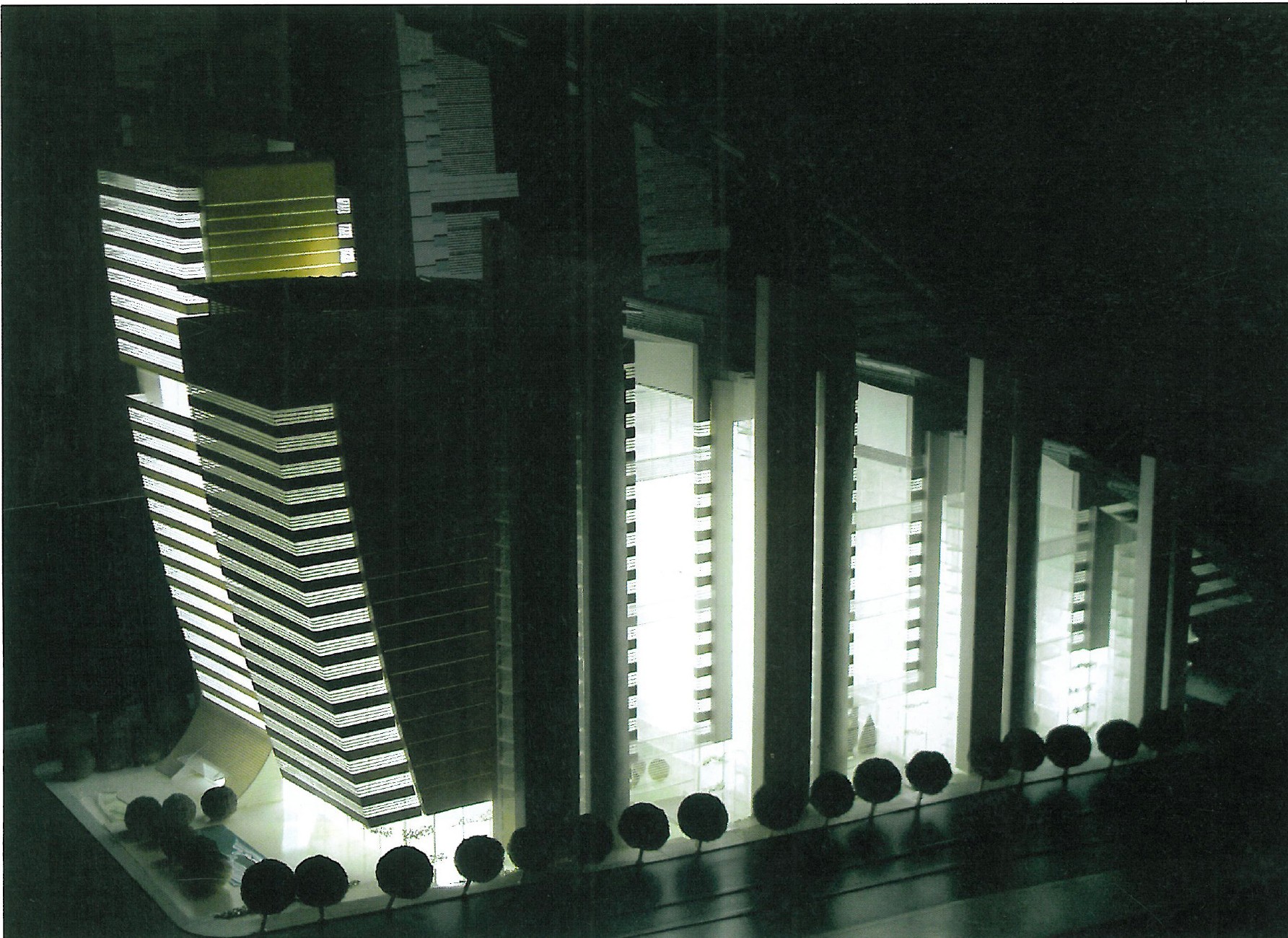 Entry 5 — night view of the principal tower with vertical fin pattern, against the city skyline