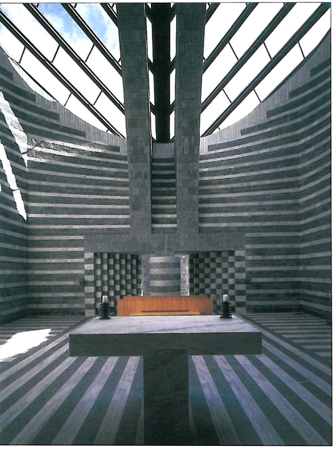 San Giovanni Church, Ticino (Switzerland) — Mario Botta. Botta has turned the wall into an architectural monument; the bodily presence of the wall, dark and light stone blocks set side by side with scientific precision and craftsmanly skill, evoke Romanesque southern Switzerland and emphasise the wall as a primary element of architecture.