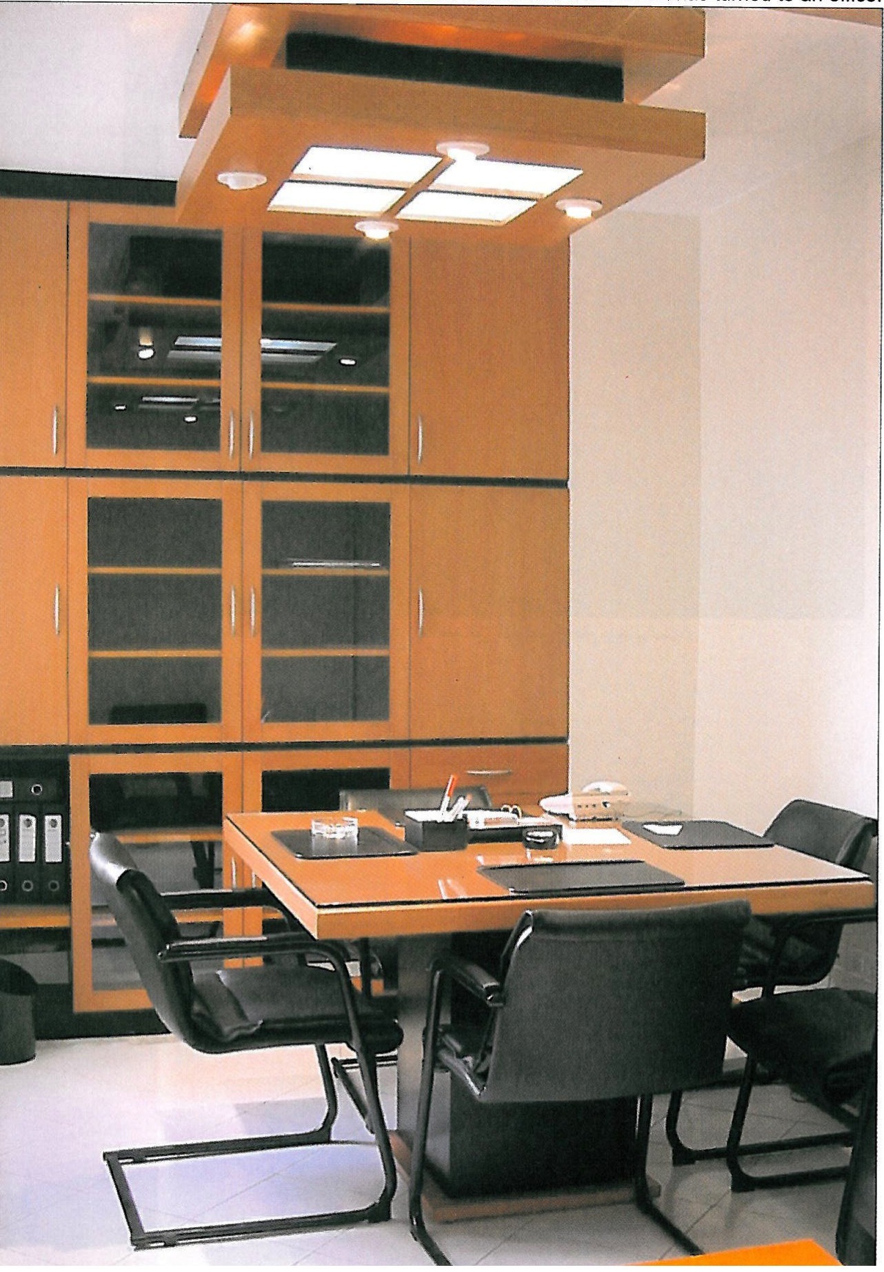 The furniture of a room that has turned to an office.