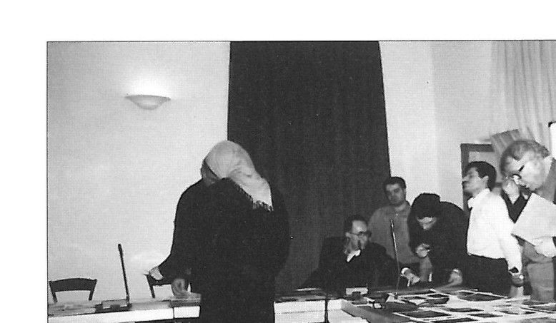 Jurors reviewing project documents at a judging session