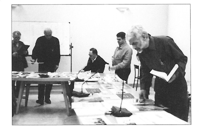 Jurors reviewing the entry panels laid out on the table