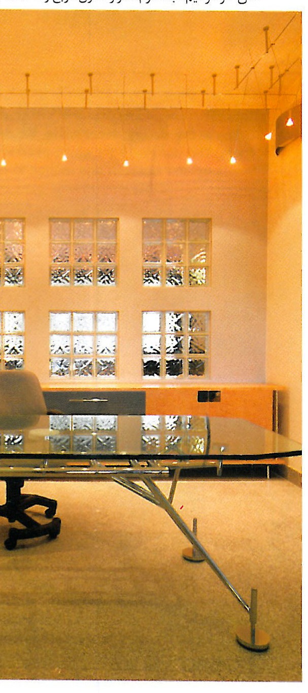 Lower reading-room level — view of the wooden bookshelves and reading desks under the columns