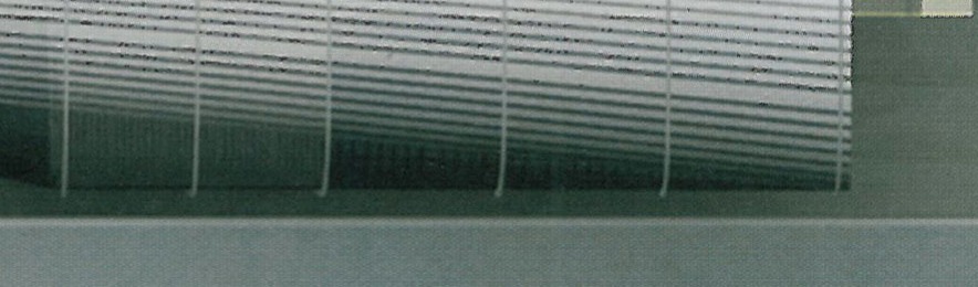 Detail of the perforated metal screen of the Technology Cooperation Office Building