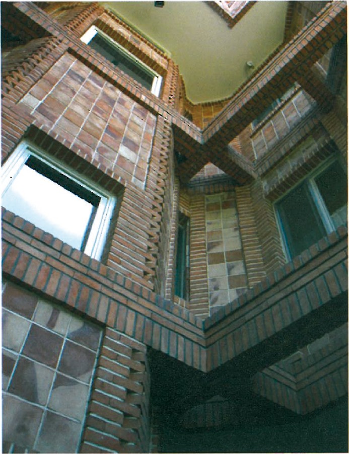 Interior detail of the Gheytariyeh house — exposed brick wall and corner window