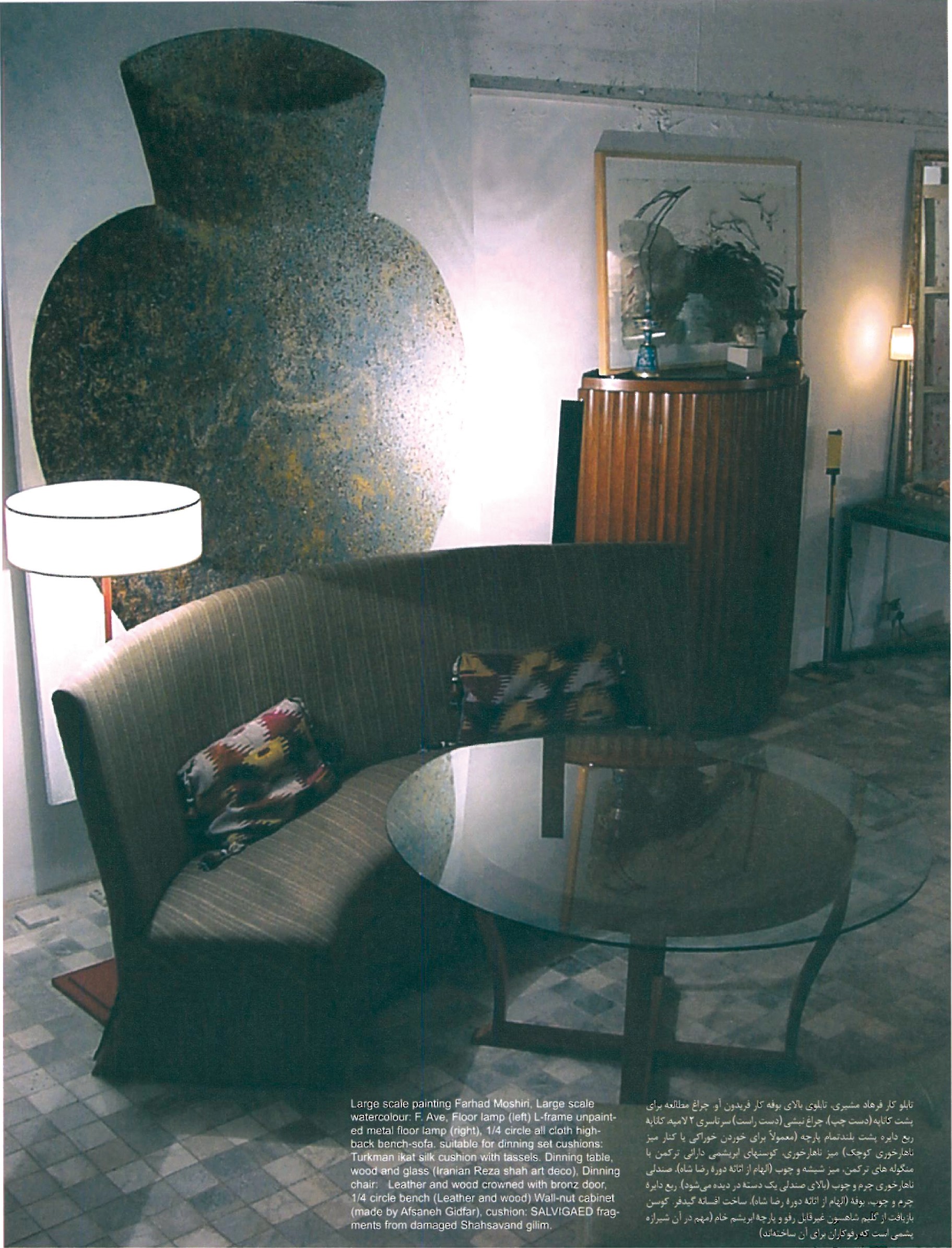 Full-page interior view: 1/4-circle high-back cloth sofa, glass-top dining table, Wal-nut cabinet, large Farhad Moshiri painting, Fereydoun Ave watercolour, two L-frame floor lamps, Turkman ikat silk cushions, recuperated Shahsavand gilim cushion