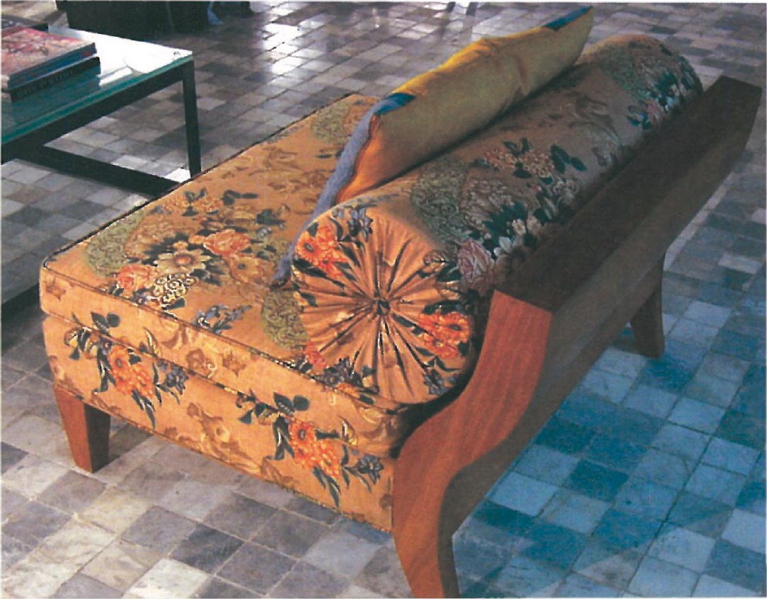 Two-sitter oriental-empire sofa: walnut frame with printed shintz upholstery and a Yazdi zilu fragment cushion