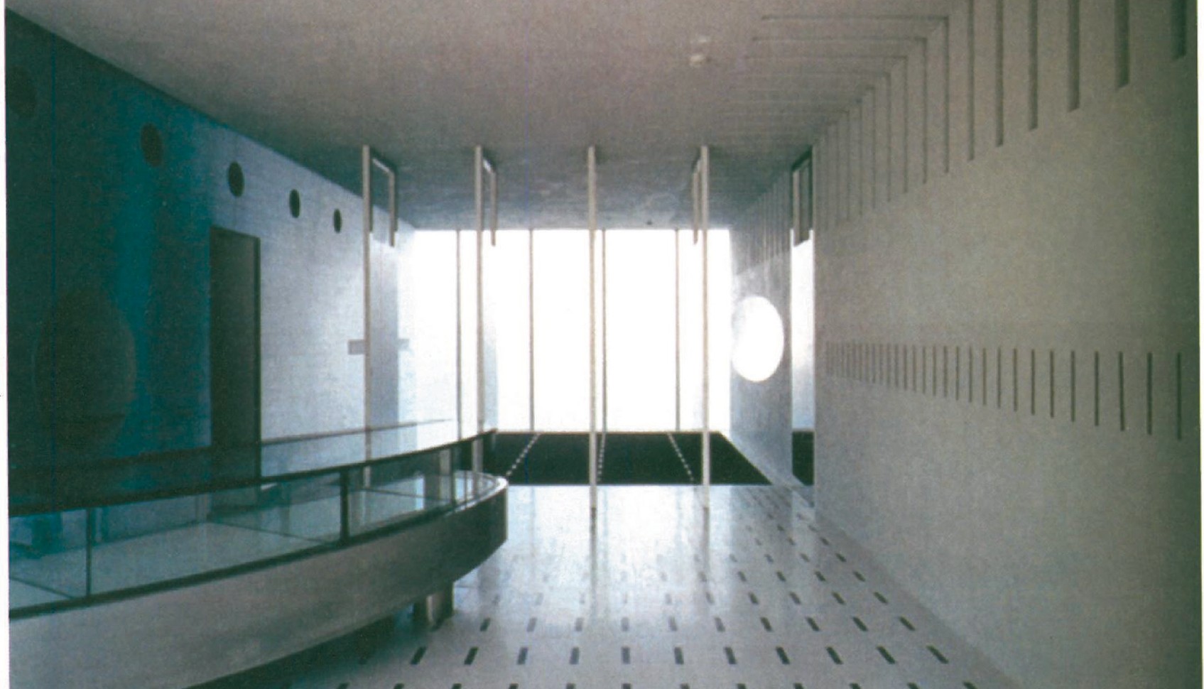 Tall interior public passage at Hillside West (Daikanyama, Tokyo, 1996-98) — the volume detached from the apartment block on the upper level