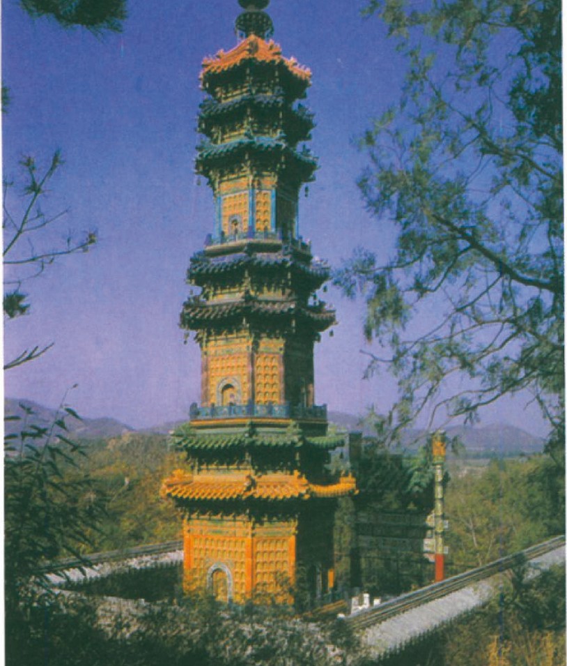 Multi-tiered Chinese pagoda with curved overhanging eaves rising above a wooded landscape