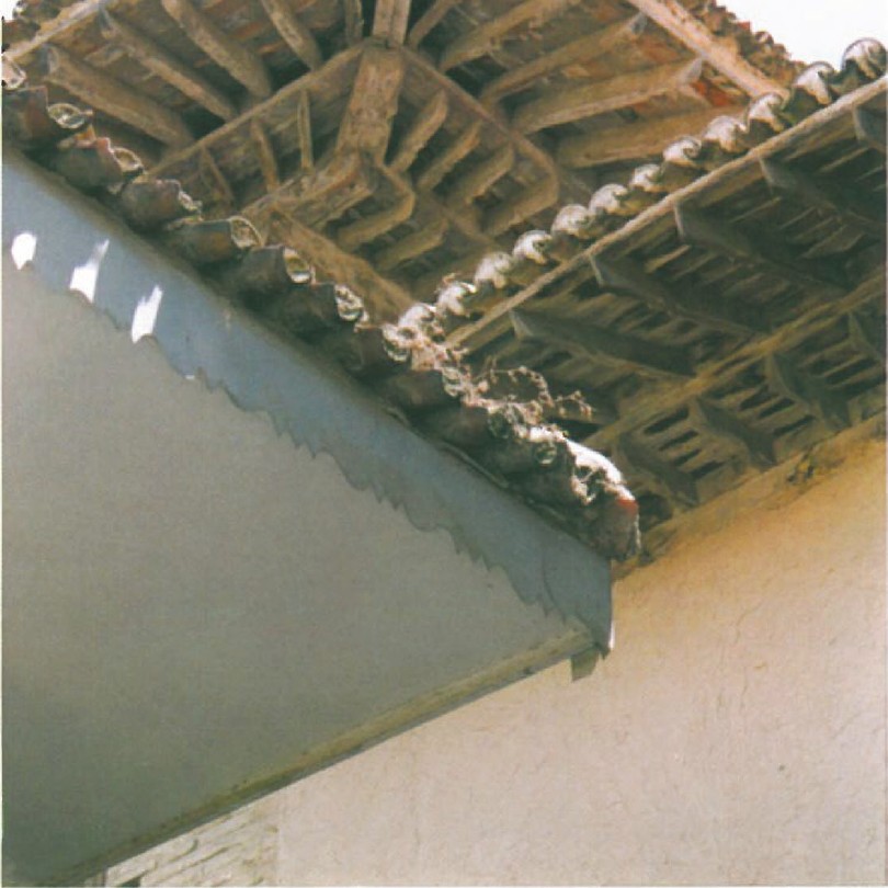 Wood decoration and traces of ceiling painting on a timber portico at Goojan in Gorgan, Iran