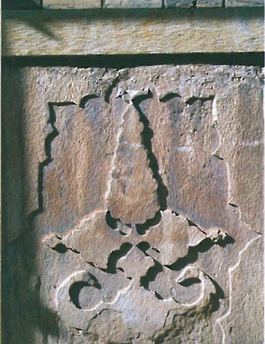 Detail photograph of an abstract stone carving on a column base
