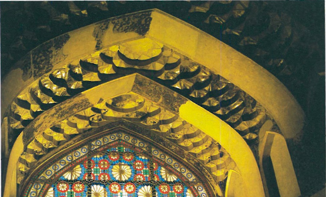 Muqarnas vault directly above the colourful stained-glass orsi window