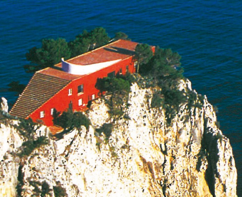 Adalberto Libera's Casa Malaparte (1938-42) on a cliff in Capri: a long red volume rising from the sea, with a single sweeping stair on its roof leading to the curved sun-deck