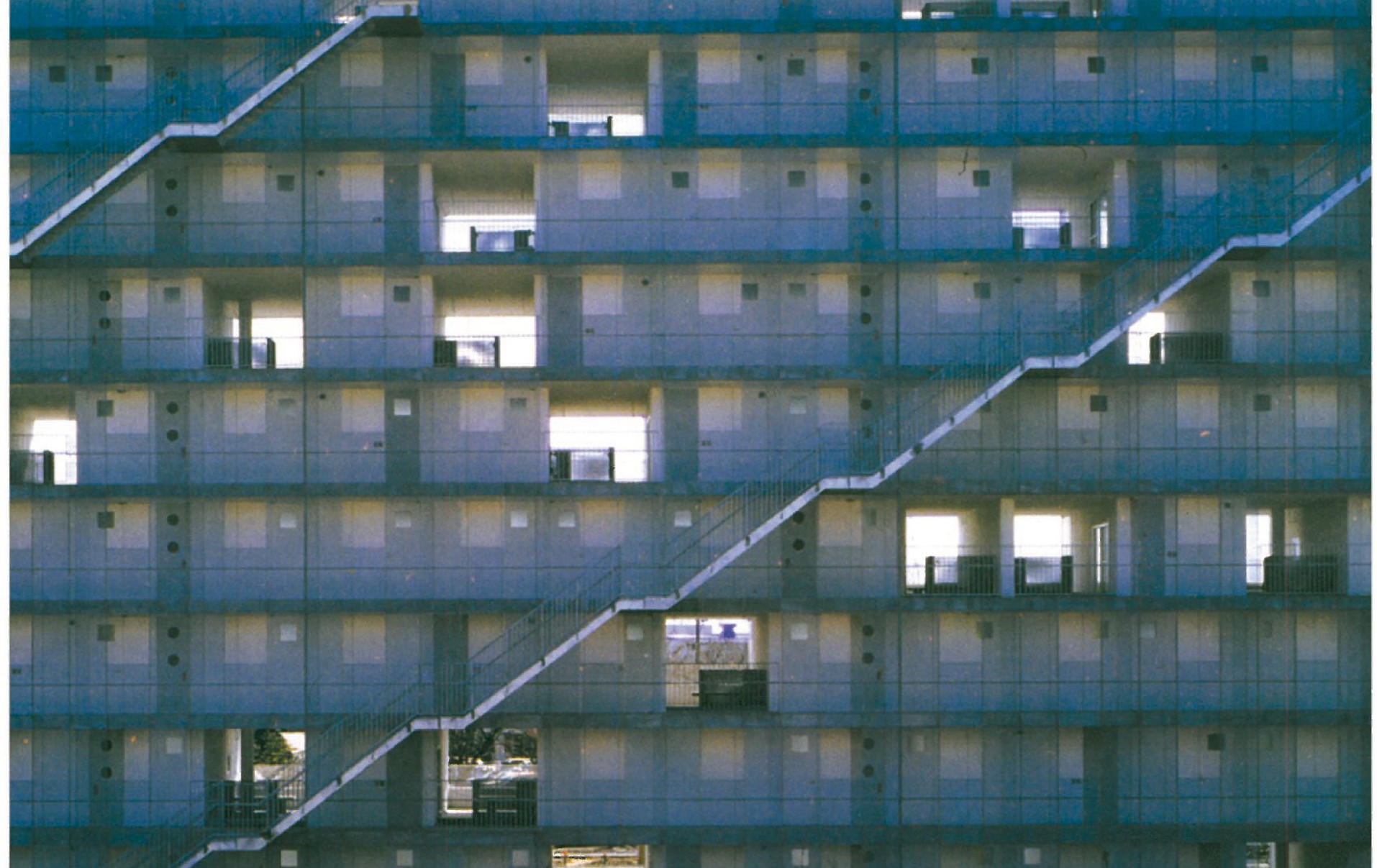 Kazuyo Sejima's Block Apartments in Gifu, Japan — the emergency stair zigzagging across the colourful facade as a deliberate architectural element