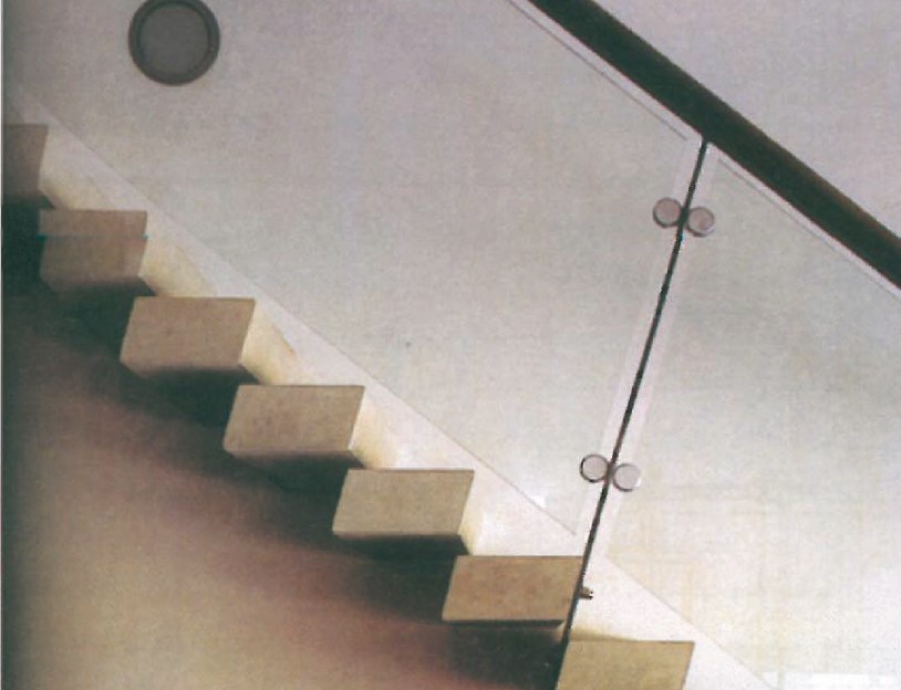 Cantilevered concrete stair without handrail inside Erik van Egeraat's Natuur museum, Rotterdam — pure volume of the riser-and-tread alone