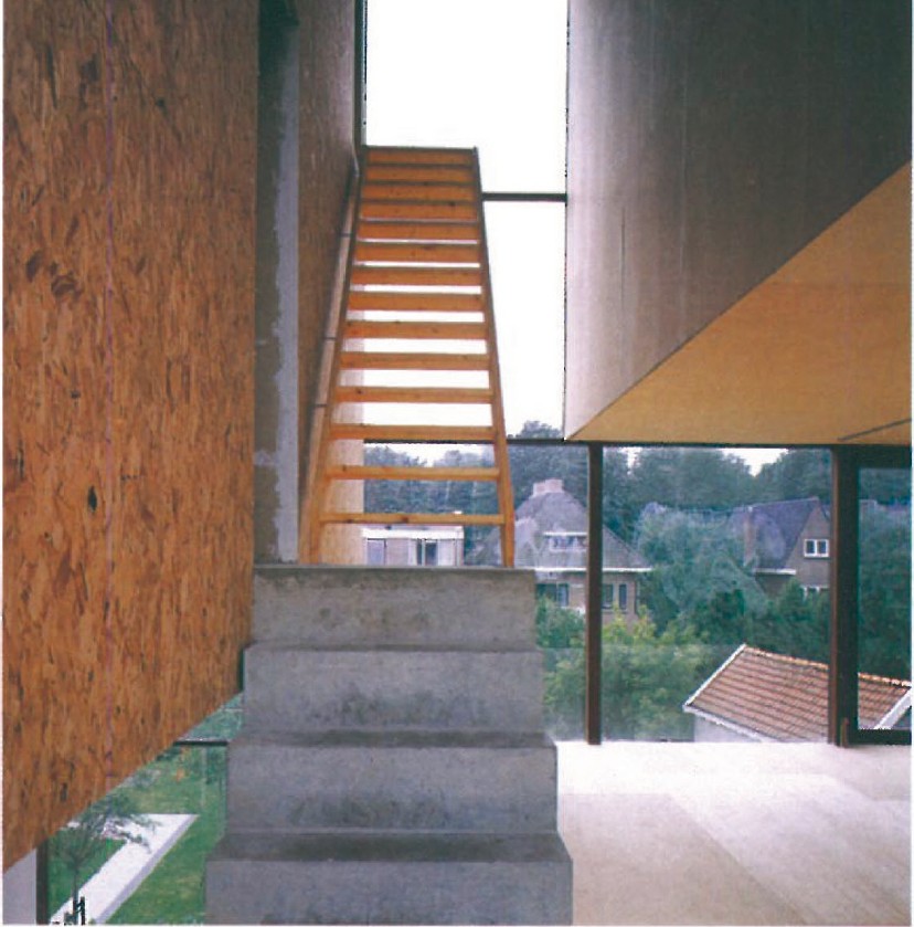 Interior view of MVRDV's residential building in Utrecht — a sculptural orange-painted timber stair set against raw concrete walls