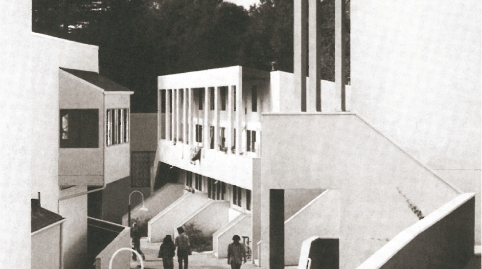 Kresge College at UC Santa Cruz by Moore Lyndon Turnbull Whitaker (1965-72, built 1974) — white residential pavilions lining a stepped pedestrian street that climbs through the redwood forest.