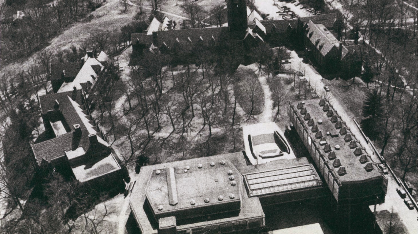 Aerial photograph of the Wellesley College Academic Quadrangle — the Jewett Arts Center (Paul Rudolph, 1958) at the foreground meeting the older Day & Klauder gothic-revival buildings (1919-35) on the rising ground above.