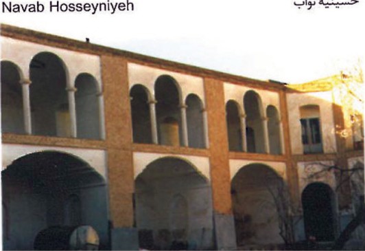 Navab Hosseyniyeh in Birjand: a two-storey brick courtyard structure with arcaded loggia above and round-arched openings on the ground floor