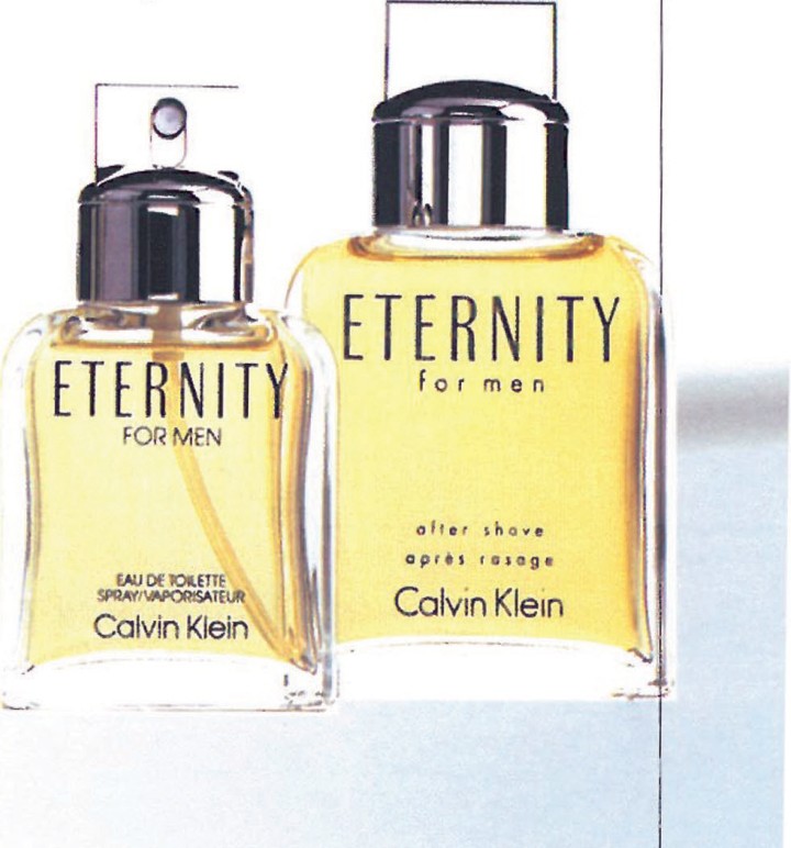 Two amber Calvin Klein Eternity for Men perfume bottles, eau de toilette and after-shave soothing lotion