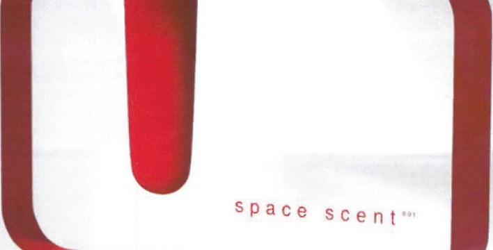 Yves Béhar's Space Scent perfume hung in a coloured fabric frame, the bottle suspended within an angular red panel
