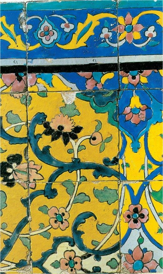 Tile panel showing an arabesque border above a yellow field with curling floral stems