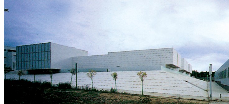 Law Faculty of the University of Girona by RCR, white modernist buildings stepping down a planted slope