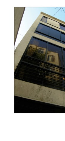The narrow street façade by day.