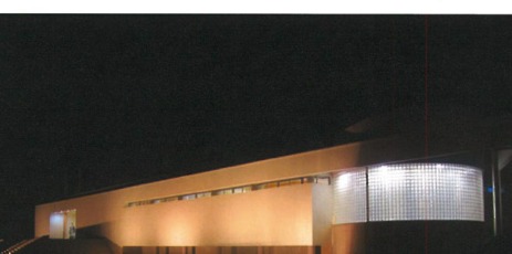 Night view of the curved glass-block facade, Indoor Pool and Recreation Center, Sari