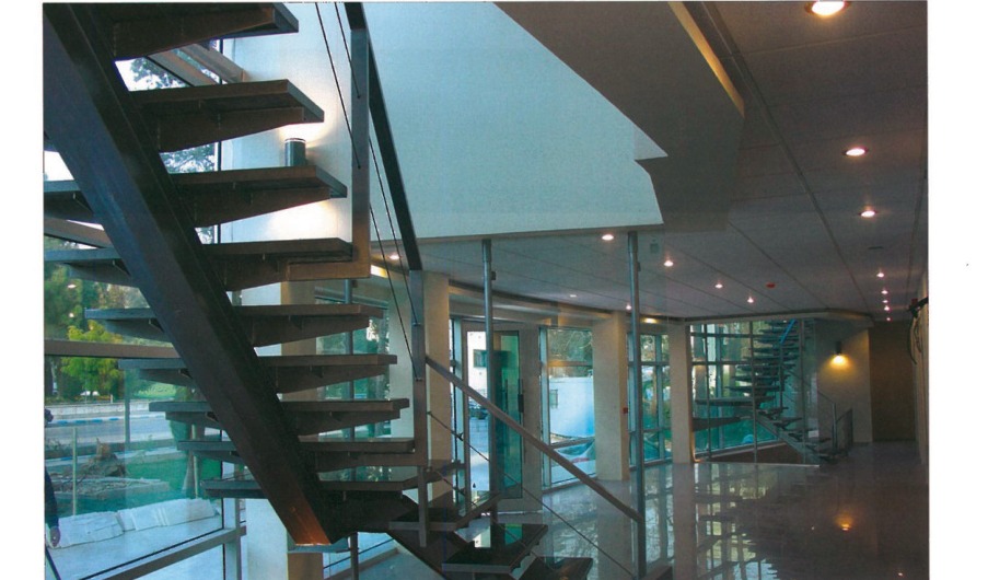 Tehran Telemetry Center entrance lobby with open steel staircase and glass walls