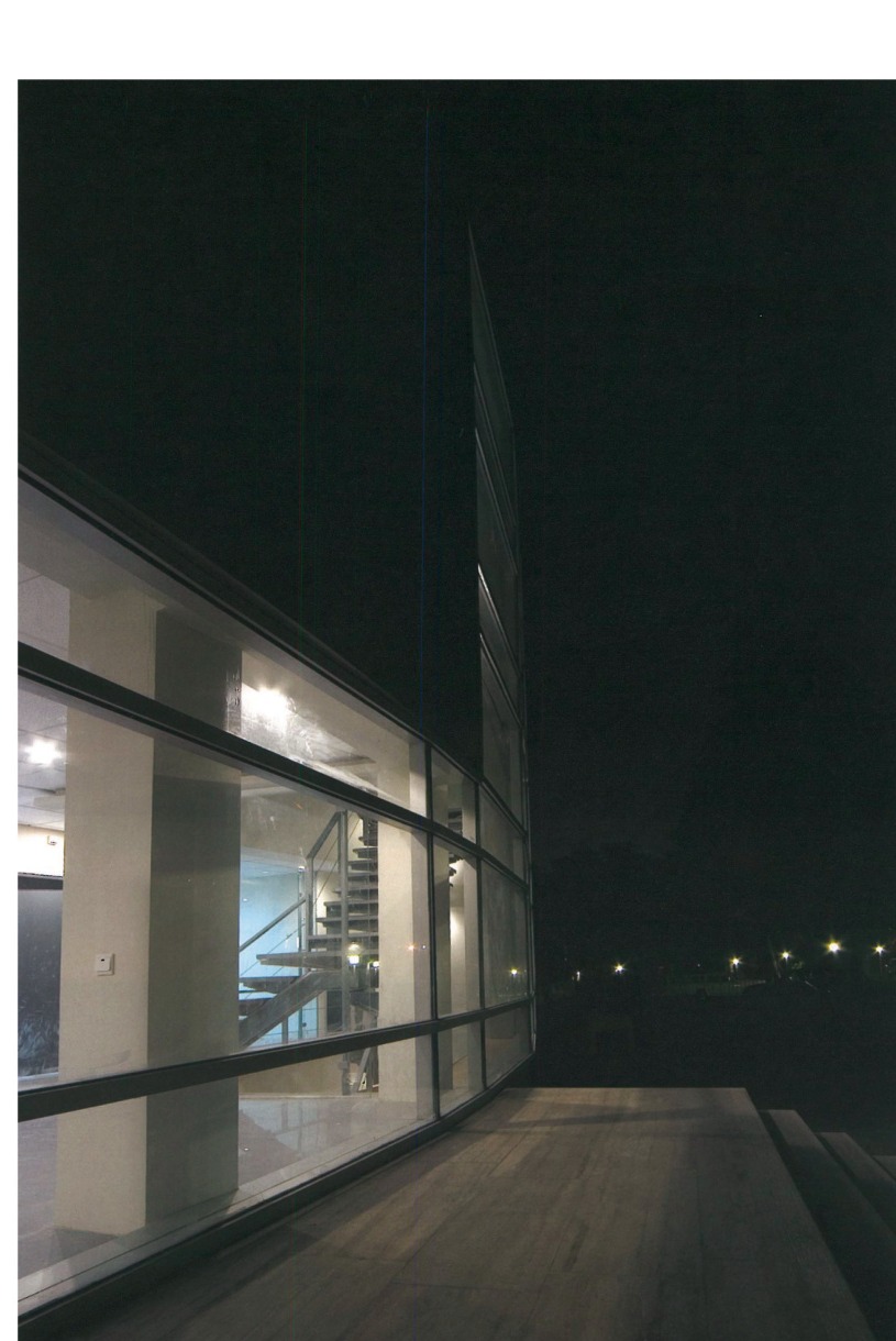 Tehran Telemetry Center entrance approach at night along curved glass facade