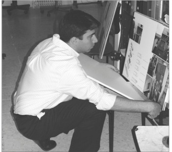 Bahram Shokouhian reviewing submissions at the 6th Memar Award