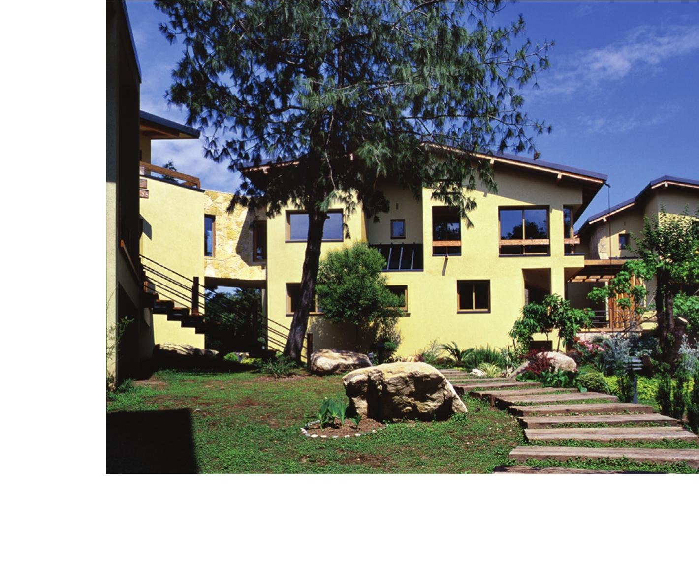 Khalili Family Village garden between villas