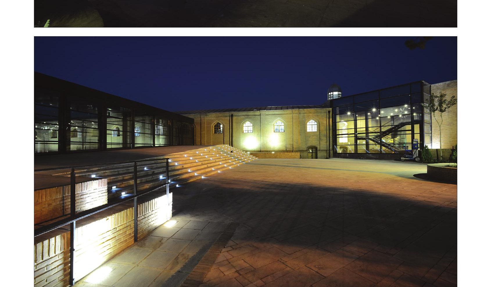 Night view of the museum entrance plaza with terraced stairs