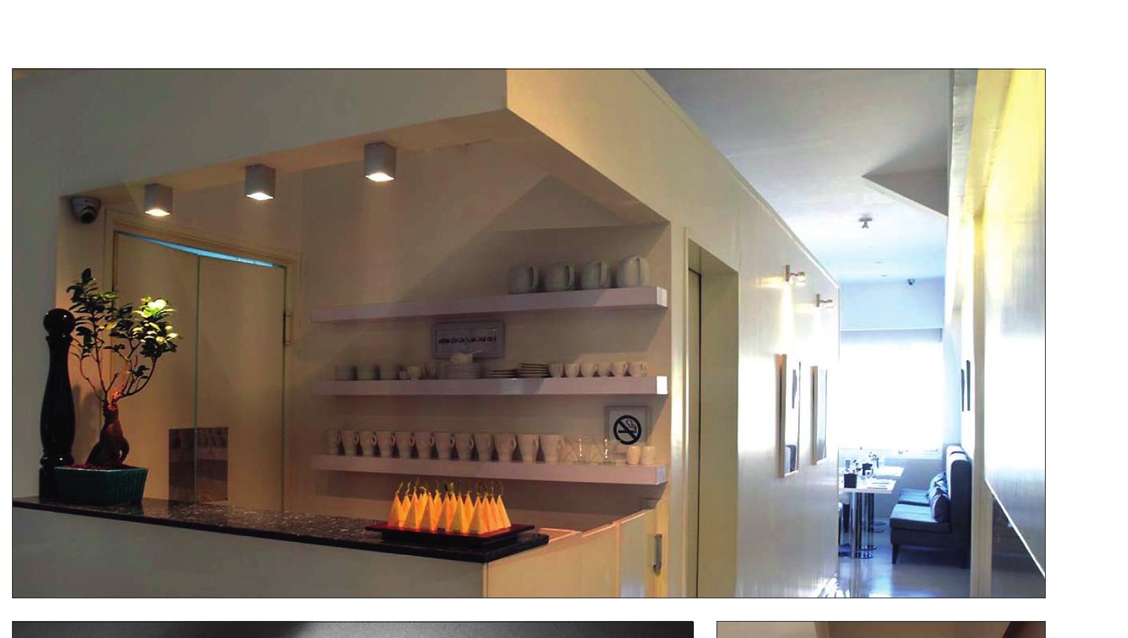 Bar and shelving wall with corridor extending to the dining area