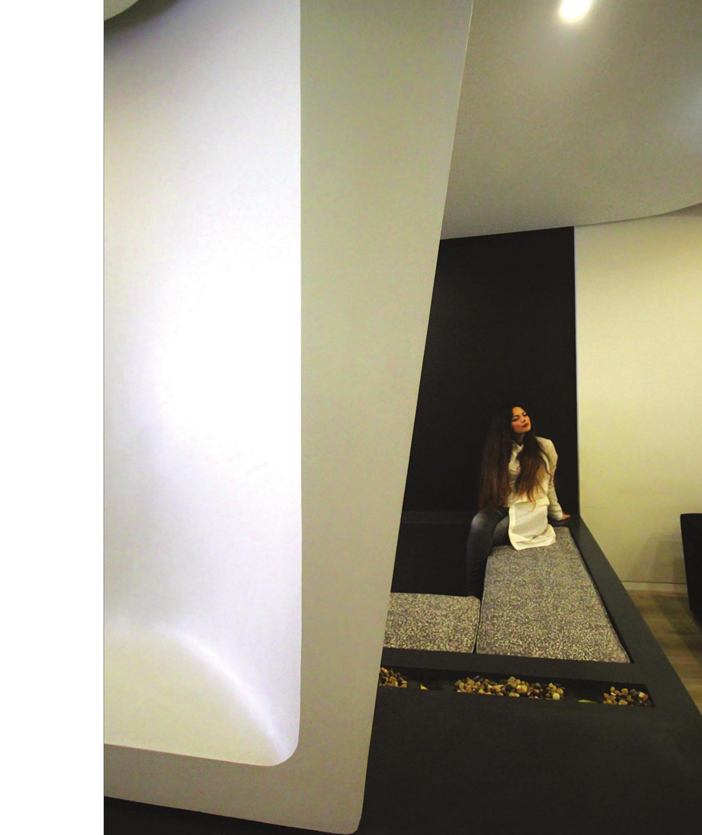 The 13th Sense — the white sculpted partition that marks the entrance threshold and seating alcove.