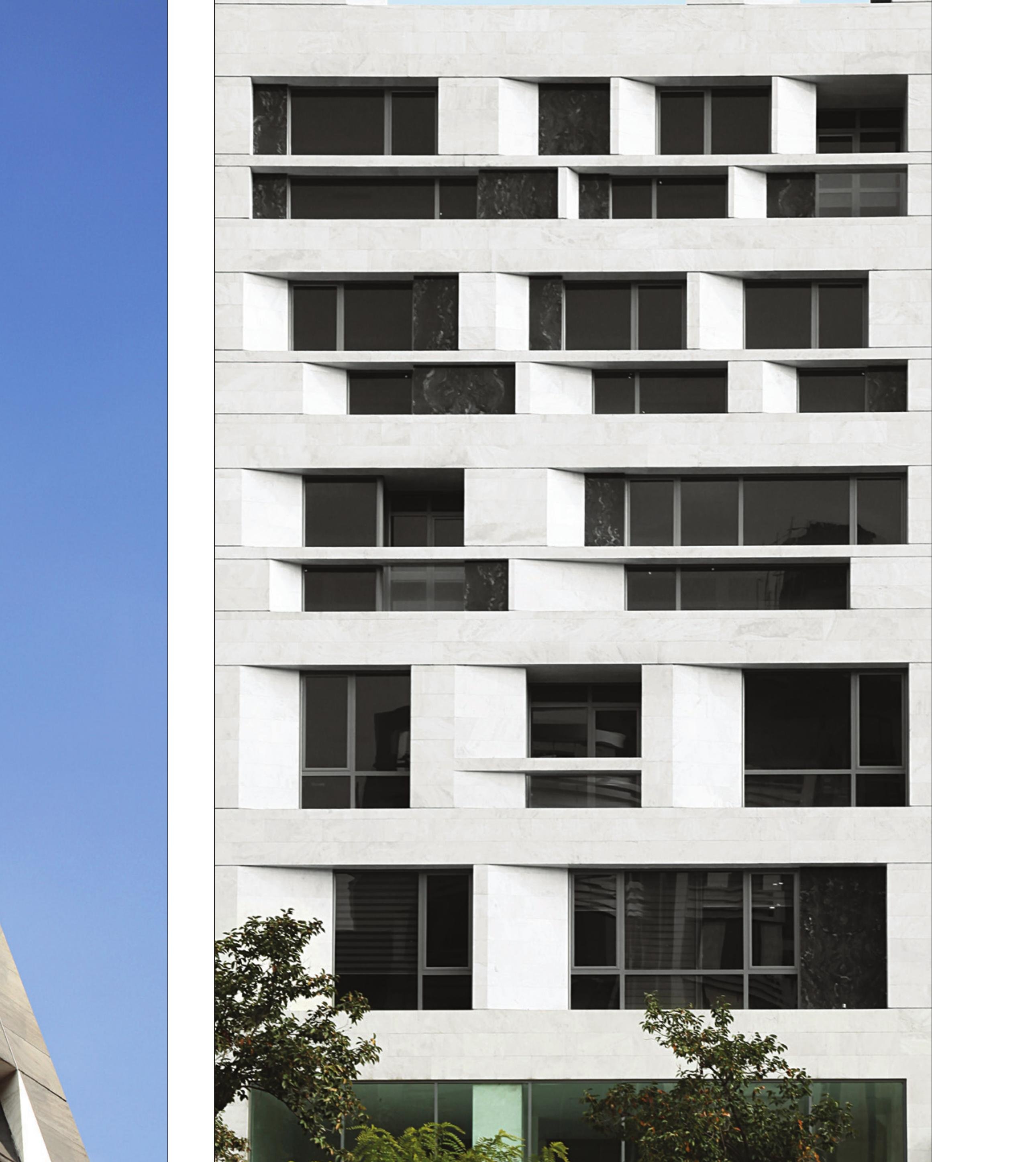 South facade in its commercial-administrative context, looking up from the boulevard.