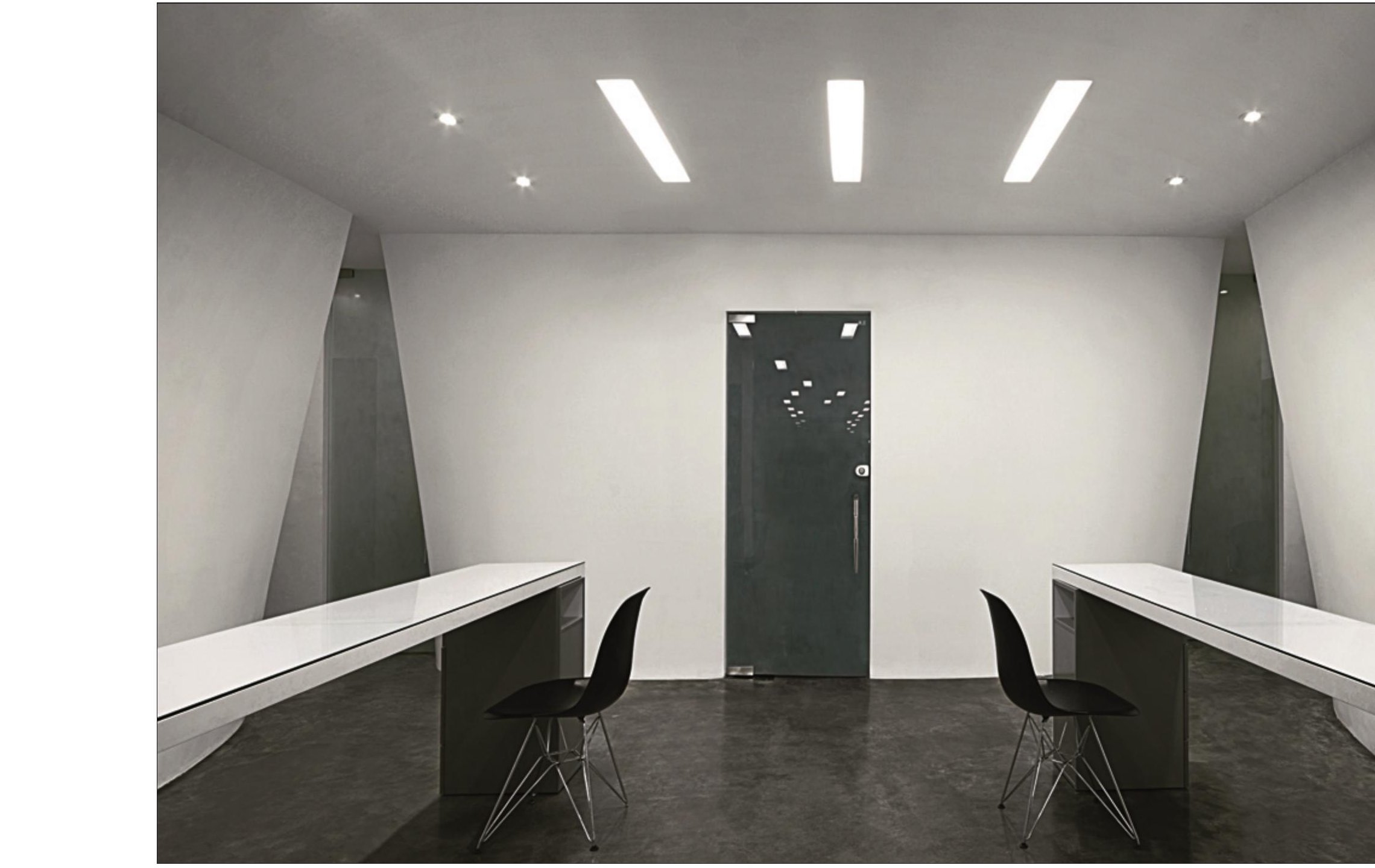 Beauty House — symmetrical treatment room with cantilevered counters and central glass door.