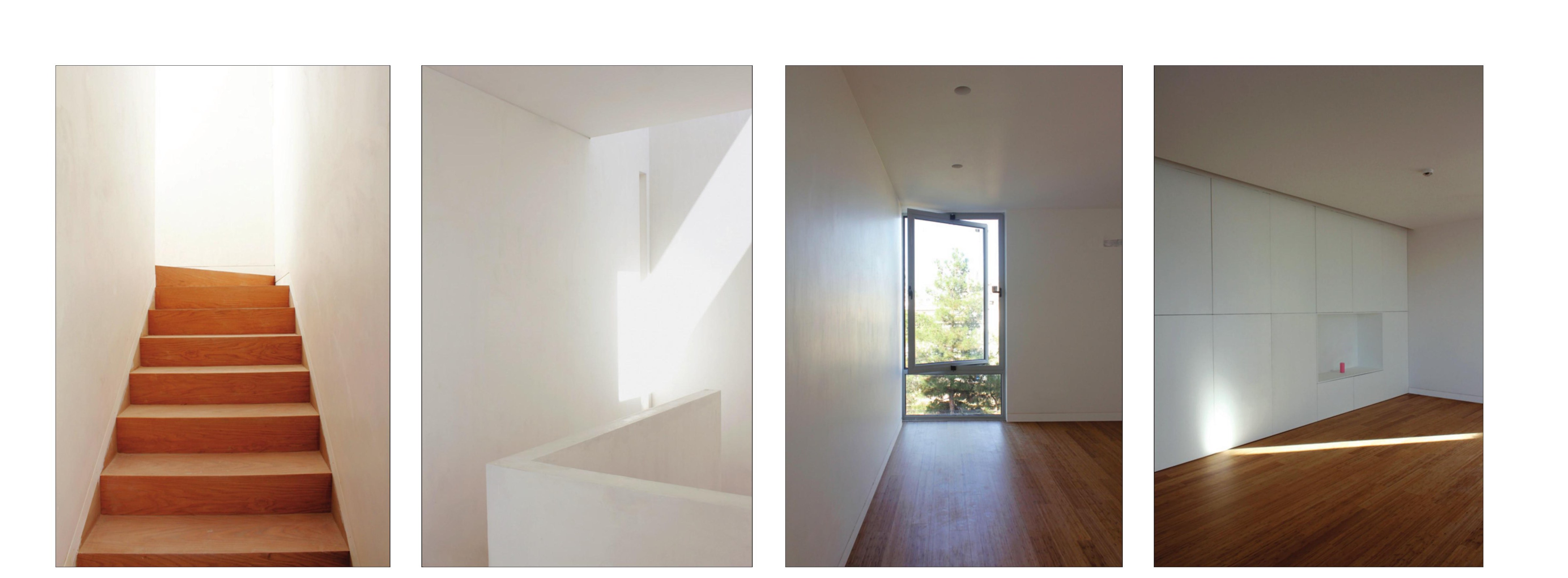 Stair and corridor sequence in white plaster and warm timber.