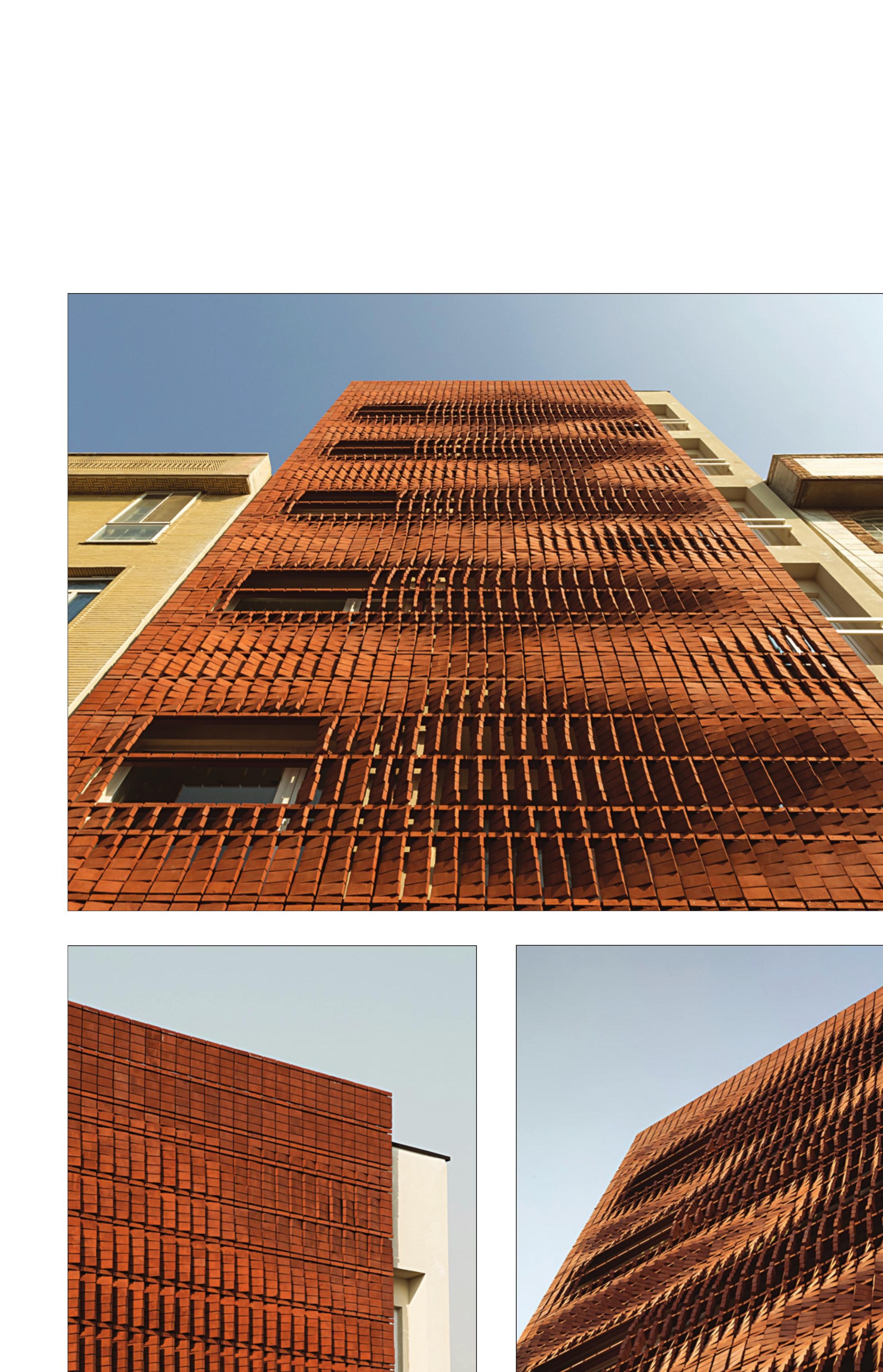 Cloaked in Bricks — close-up of the diagonal brick fins on the long facade.