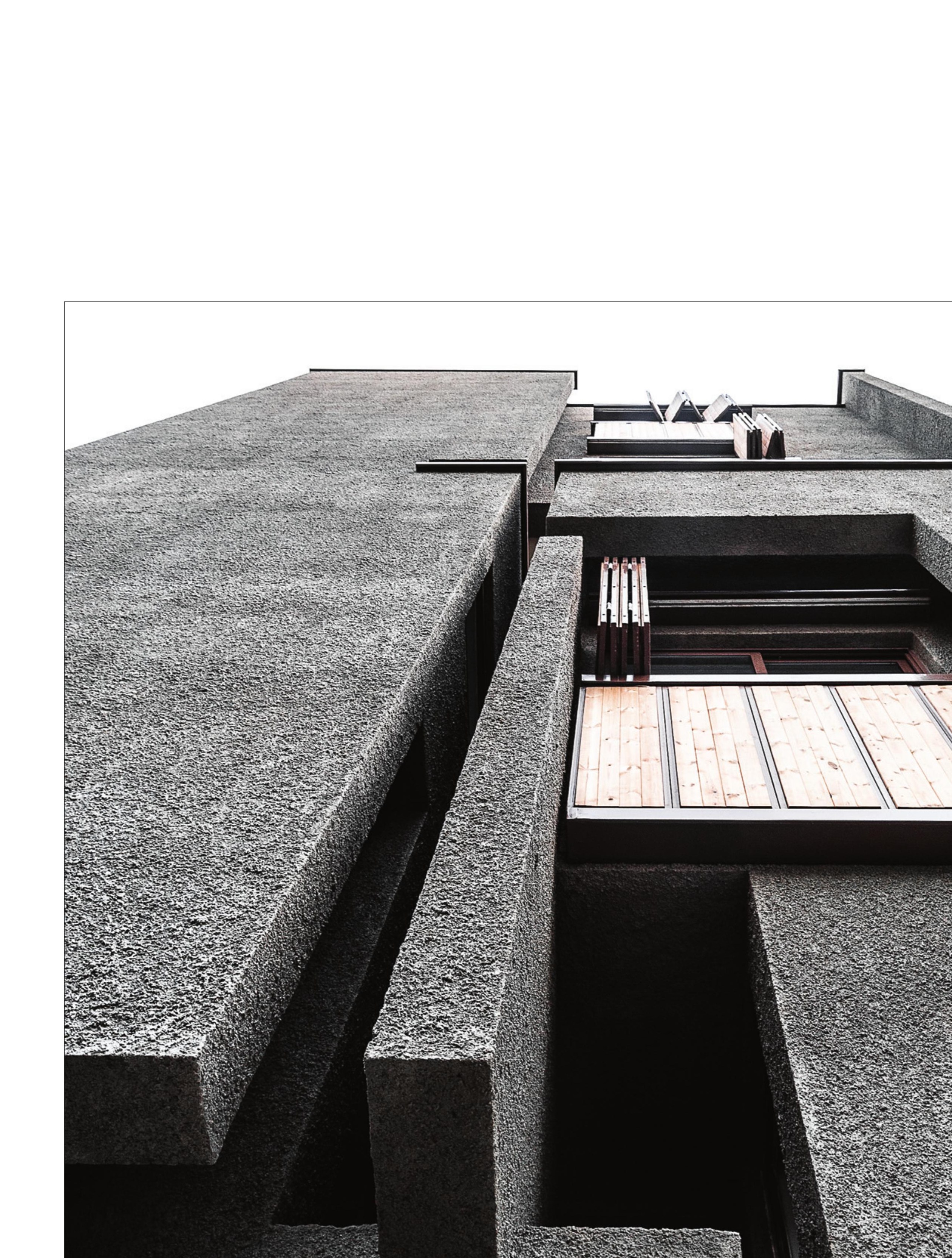 Concrete-textured cleft cut into the volume — the project's signature gesture.