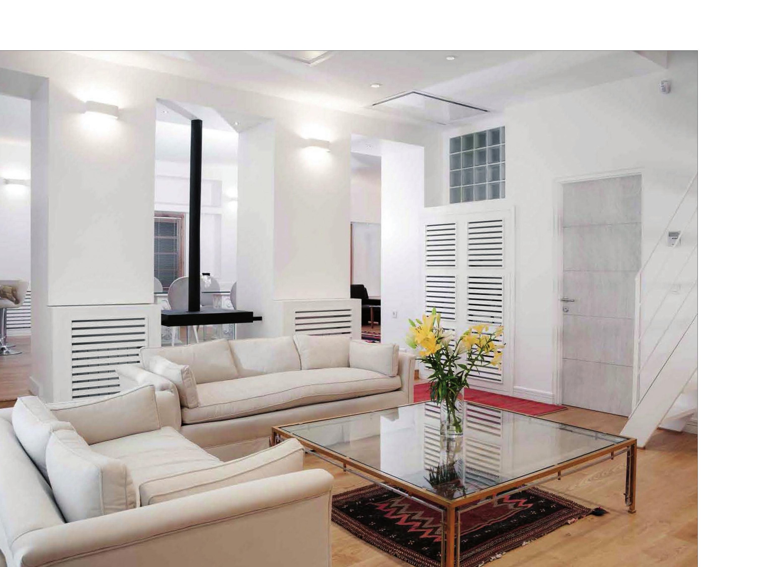 Apartment No.2: lounge with fireplace and the timber-framed windows.