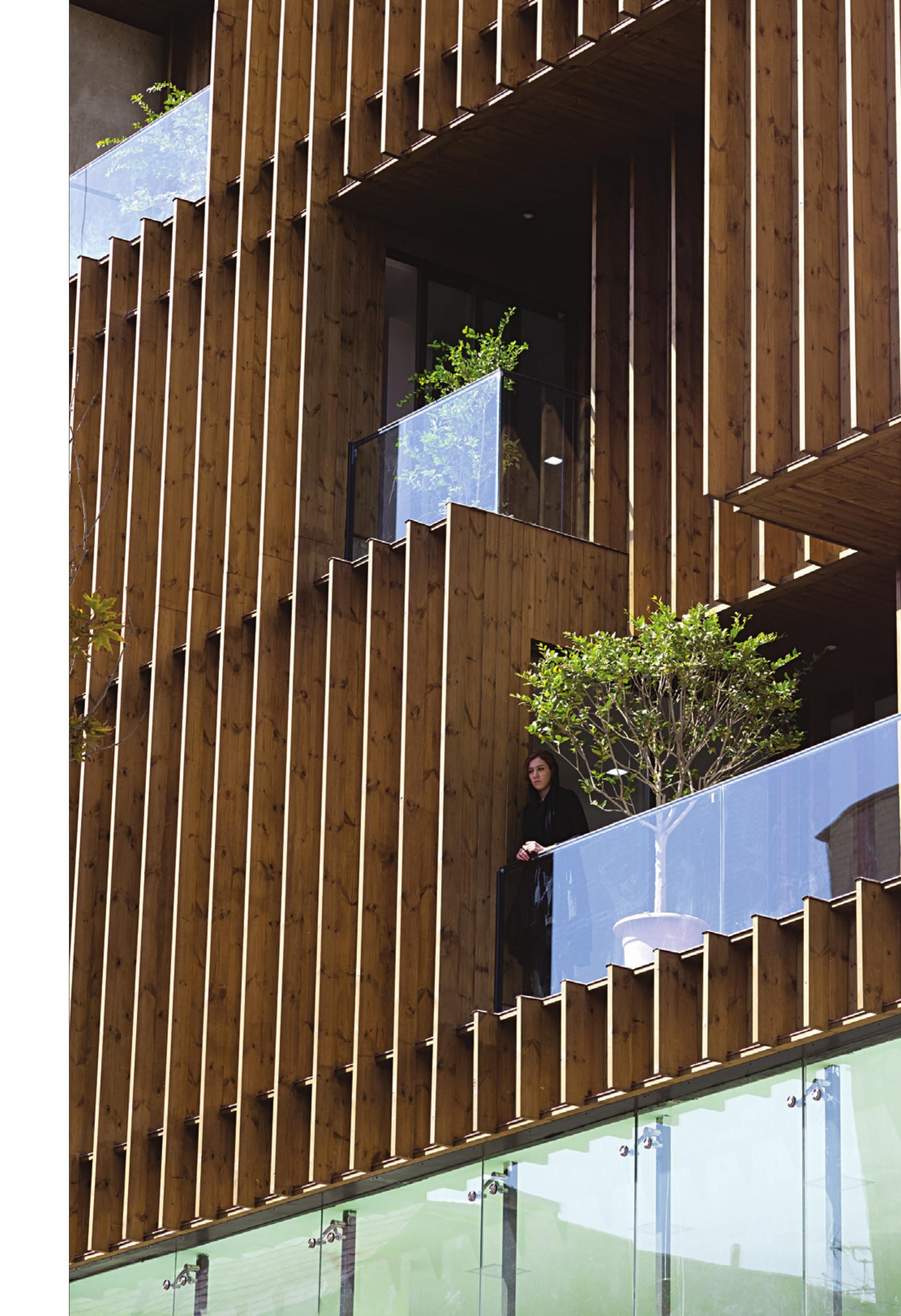 Close-up of the vertical timber louver screen on the south facade.