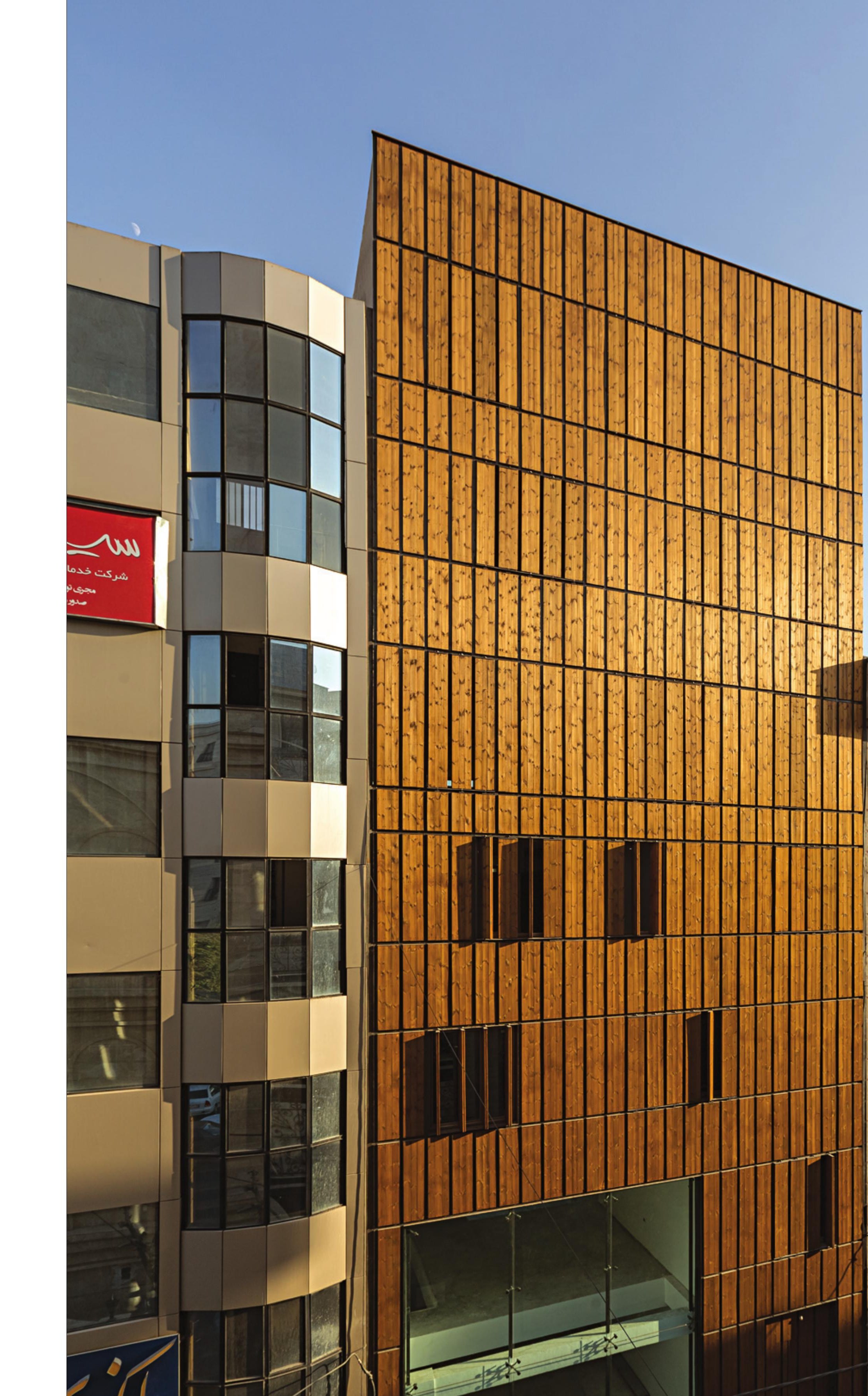 Sunset view of the north facade with matching louver modulation.